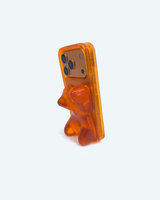 Orange phone case shaped like a bear on a white background