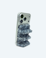 Phone case with a blue speckled design on a white background