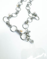 silver chain attached to clear tab