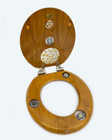 Pretzels and Watches Collage Experiment in Round Wooden Toilet Seat