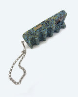 wristlet on the bottom of a phone, with the case standing on its side