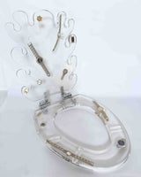 clear toilet seat with watches inside, on a white background