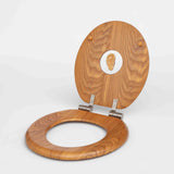 Wooden toilet seat with an ear in the middle on a white background