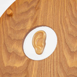 close up of the ear in the toilet seat