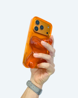 Hand holding an orange phone case against a white background