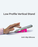 Hand using a smartphone with a pink anti-slip silicone stand on a white background