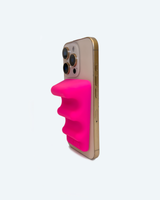 Smartphone with a pink grip case on a white background