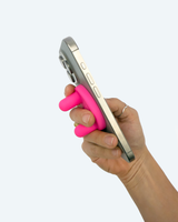 Hand holding a smartphone with a pink grip on a white background