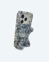 A 3D bear-shaped phone case with a speckled gray and white glitter finish, shown on a light gray background.