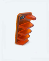 orange phone case on black iphone standing up